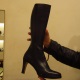 Boot slave displaying boot for Mistress Troy